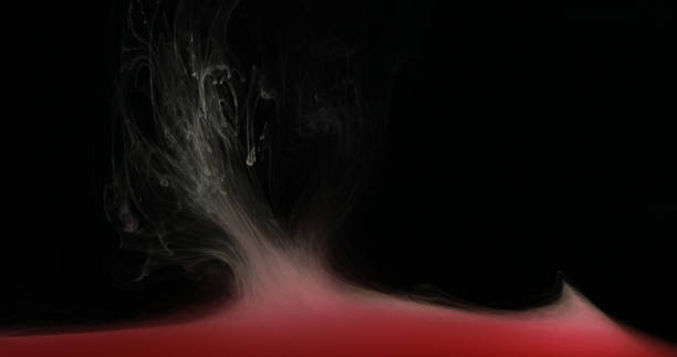 istock Red Ink Paint in Water Creating Liquid Artistic Shapes 925550168