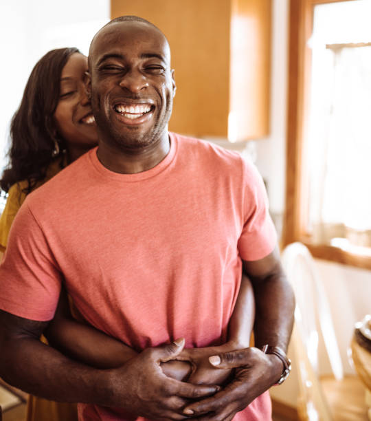 istock couple embracing in the kitchen 925552508