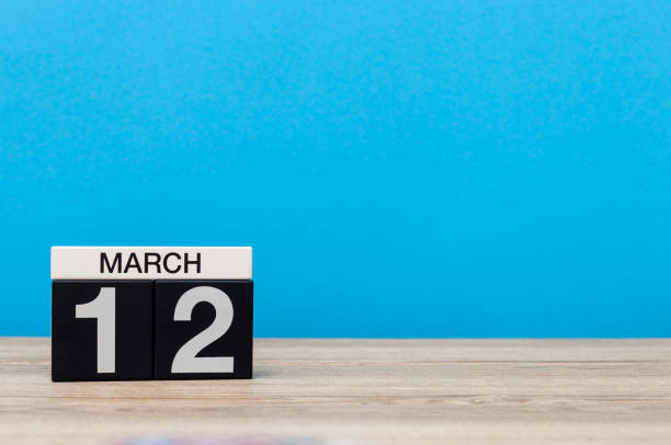 istock March 12th. Day 12 of march month, calendar on light blue background. Spring time, empty space for text, mockup 925552808
