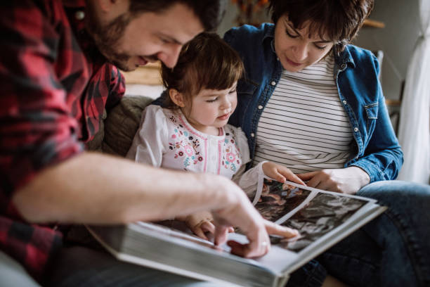 istock Taking a look at some old family photos 925554612