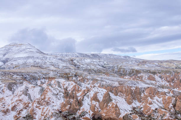 istock Snow covers the red rock formations in Cappadocia 925561184