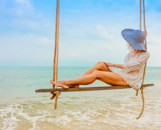 istock Woman at tropical swing 925561448