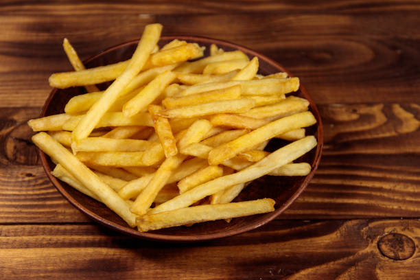 istock French fries on wooden table 925564712