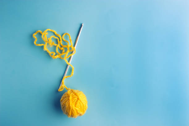 top view of knitting ball and yellow yarn Isolated On White