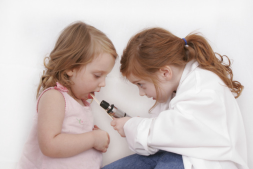 Little girls playing doctor