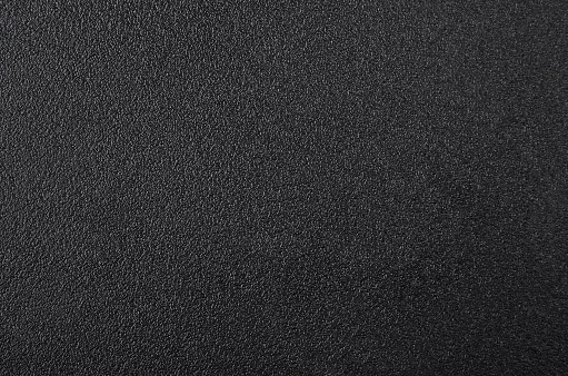 Close up of black textured plastic background