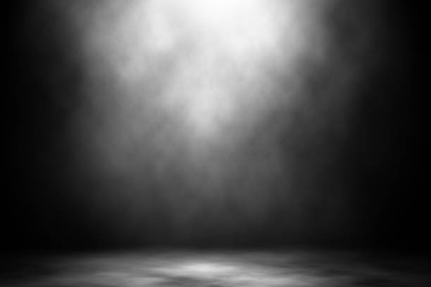 istock White spotlight smoke nightclub studio entertainment background. 925583066