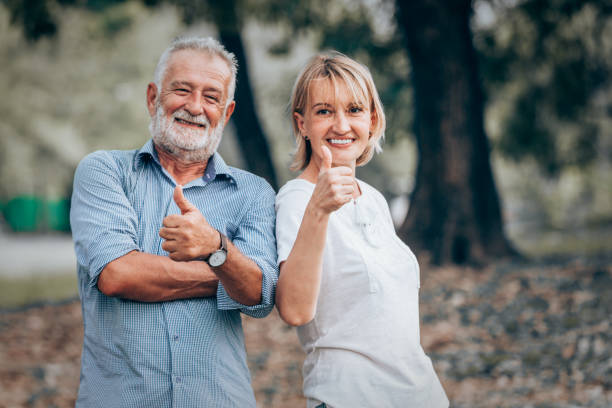 istock Senior couple showing thumbs up 925596904