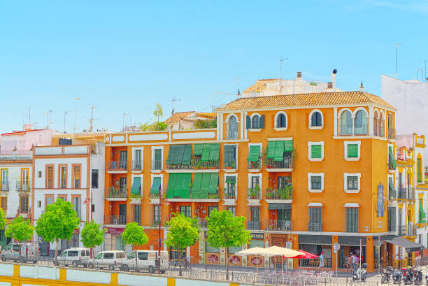 View from the coast of the Guadalquivir to the Triana district in Seville. Spain. Seville, Spain - June 08, 2017 : View from the coast of the Guadalquivir to the Triana district in Seville. Spain. seville port stock pictures, royalty-free photos & images