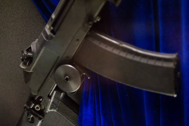 Close up of gun barrel on the wooden table