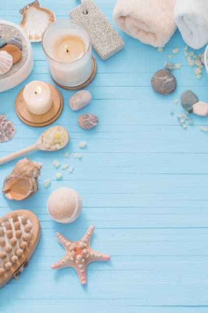 istock Spa concept with candles on blue wooden background 925605548