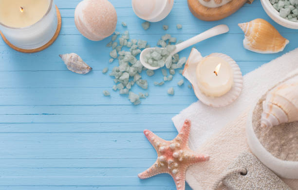 istock Spa concept with candles on blue wooden background 925605554