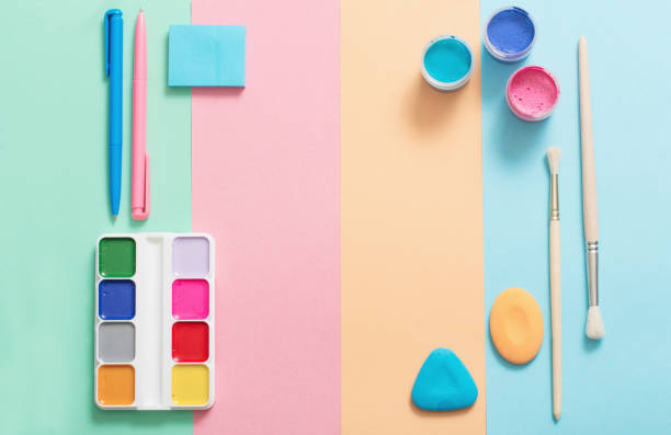 istock school supplies at  colorful paper background texture 925605592