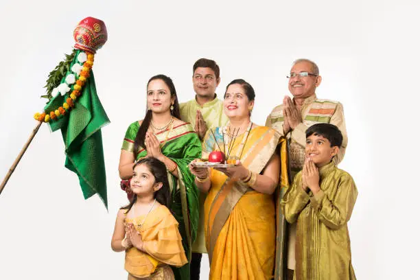 Indian family celebrating Gudi Padwa or Ugadi festival, which is a new year in Hindu tradition