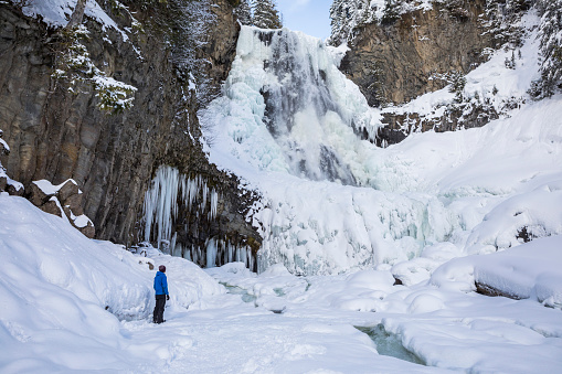 Man in 30’s on snowshoeing adventure near Whistler, British Columbia, Canada.
