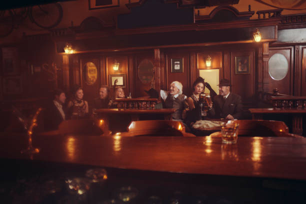 Celebration Retro pub Old-fashioned group of senior men and young woman drinking beer Party Celebration Retro pub Old-fashioned group of senior men and young woman drinking beer Party cigarette photos stock pictures, royalty-free photos & images