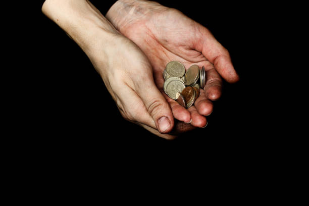 Palm of a peasant woman with coins Palm of a peasant woman with coins. Closeup a penny saved stock pictures, royalty-free photos & images