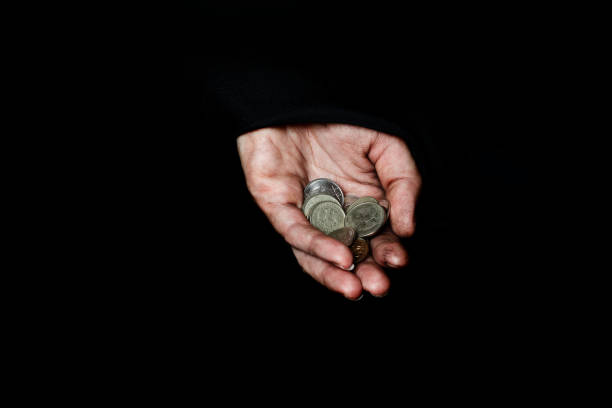 istock Palm of a peasant woman with coins 925619592