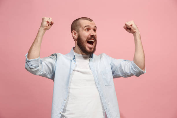 istock Winning success man happy ecstatic celebrating being a winner. Dynamic energetic image of male model 925622916