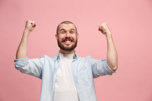istock Winning success man happy ecstatic celebrating being a winner. Dynamic energetic image of male model 925622970