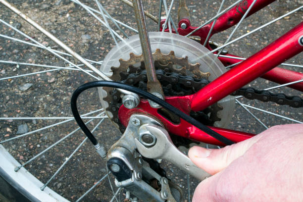 istock A hand with a wrench turns a bicycle wheel nut 925629588