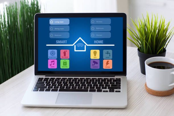 istock Computer laptop with smart home on screen desk home room 925632446
