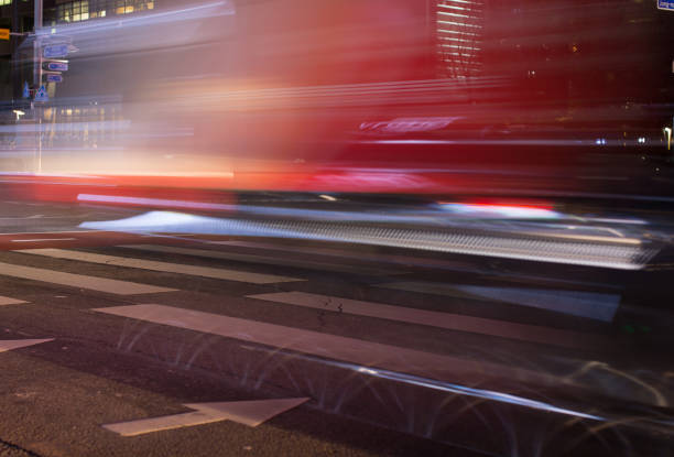 istock Lights from Vehicles Pass Quickly Through Street Intersection. Long Exposure. 925633316