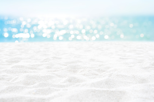 Clean white sand texture at summer beach for background - can be used for montage or display your objects on top