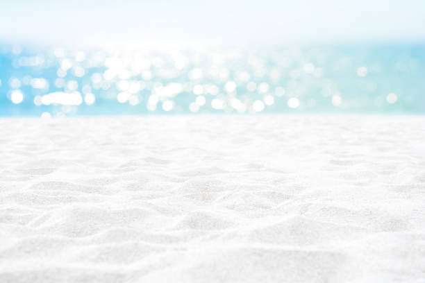 Clean white sand texture at summer beach for background Clean white sand texture at summer beach for background - can be used for montage or display your objects on top glittering sea stock pictures, royalty-free photos & images