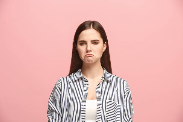 istock Beautiful woman looking suprised and bewildered isolated on pink 925639138