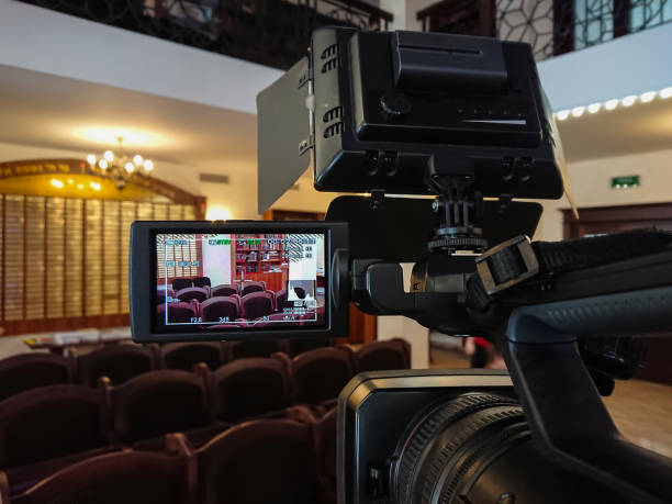 istock Videography in the interior. Digital video camera with LCD display. Led on-camera light 925640158
