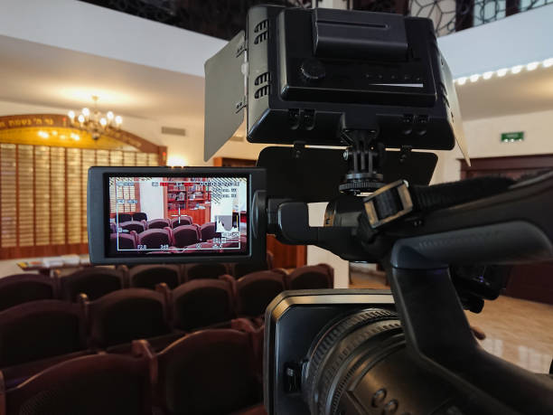istock Videography in the interior. Digital video camera with LCD display. Led on-camera light 925640178