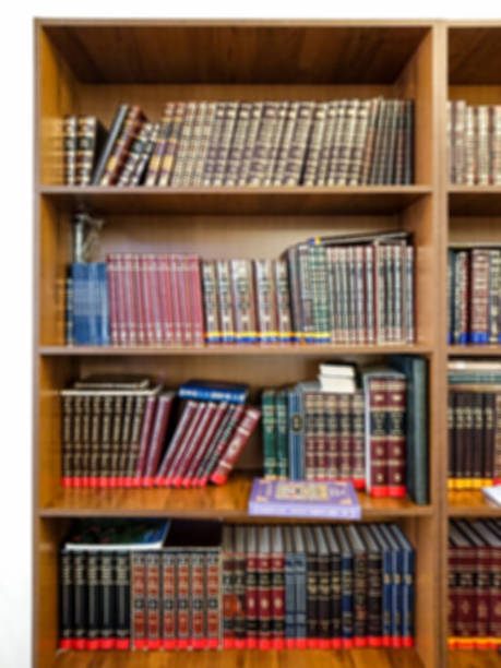 istock Defocused image. Multi-colored books on the bookshelf in the library. The bokeh effect 925640182