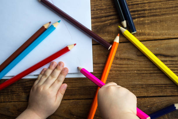 istock little boy draws on white paper 925643580