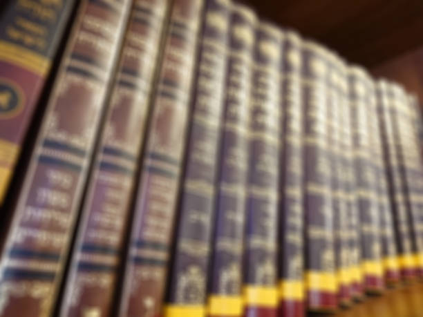 istock Defocused image. Multi-colored books on the bookshelf in the library. The bokeh effect 925644322