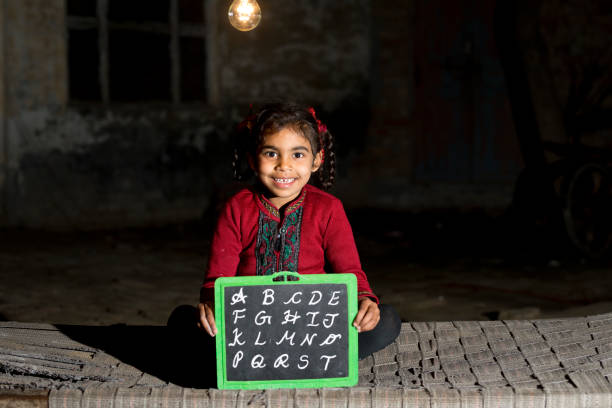 istock Rural Indian girl holding slate 925644662