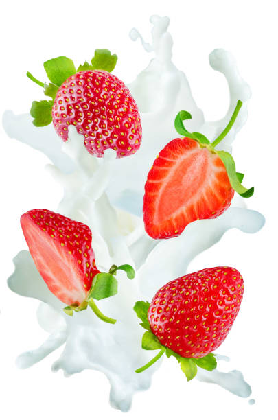 istock Flying strawberries with a spray of milk isolated 925647264