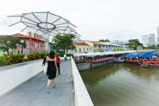 the clarke quay area along singapore river is a retail and commercial draw card for tourist and locals alike - editorial asia singapore tourist imagens e fotografias de stock