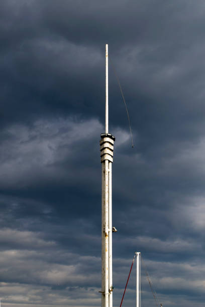 istock Flagstaff without flag against the cloudy sky. 925649072