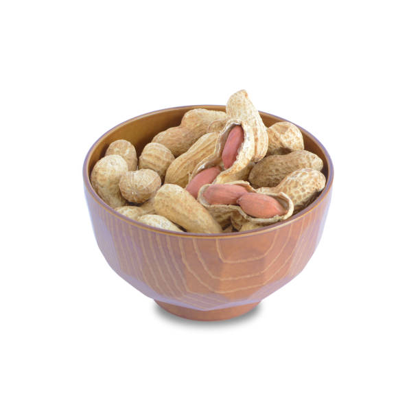 istock Dried Peanuts in a bowl isolated on white background. 925652360