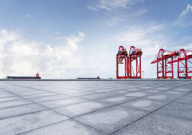 istock industrial cranes at commercial dock against sky 925652470