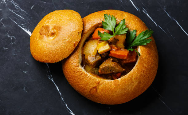 istock Beef meat soup Goulash in Bread 925657560