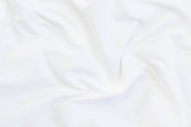 istock Close up of white bedding sheets and copy-space. 925664892