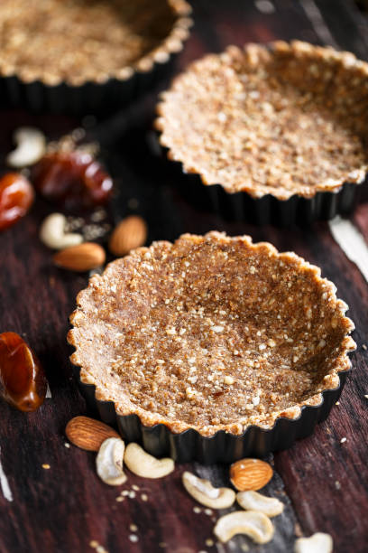 istock Vegetarian Pie Bottom with Nuts, Dates and Sesame Seeds. Vegetarian cuisine. 925665222