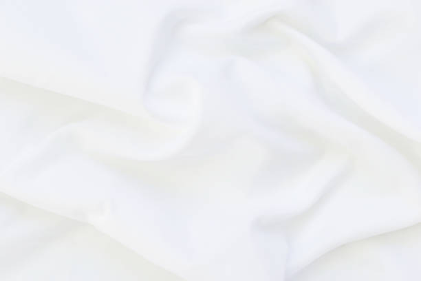 istock Close up of white bedding sheets and copy-space. 925665284