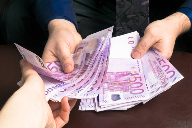 istock Human hands exchanging money - closeup shot 925667964