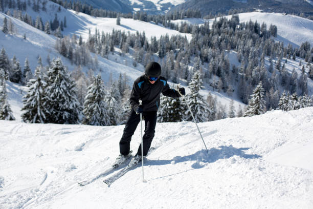 istock Young man, skiing in Austrian Alps 925668392