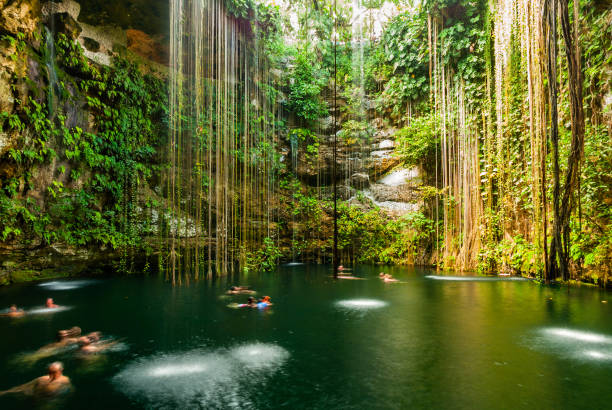 Cenote Ik Kil in Mexico The famous Ik Kil Cenote on the Yucatan peninsula in Mexico. Right next to Chichen Itza. cenote stock pictures, royalty-free photos & images