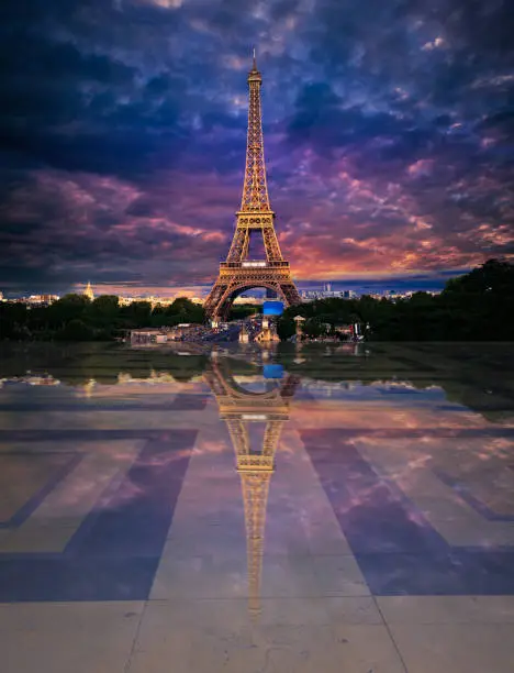 Eiffel Tower from Trocadero with photomount reflection on soil at sunset