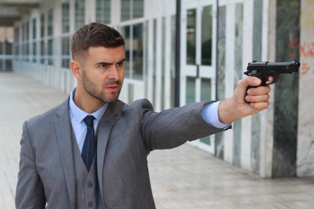 istock Businessman about to shoot someone 925677832